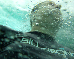 Me Surfacing From a Jump Off the Rock at Waimea Bay