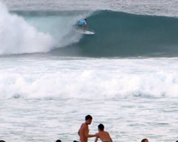 Matt Wilkinson Exits a Perfect Tube Close to Spectators on the Shore at Pipe Masters Triple Crown of Surfing